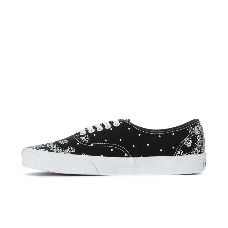 Black Vans low-top lace-up sneakers with white bandana pattern and white sidewall