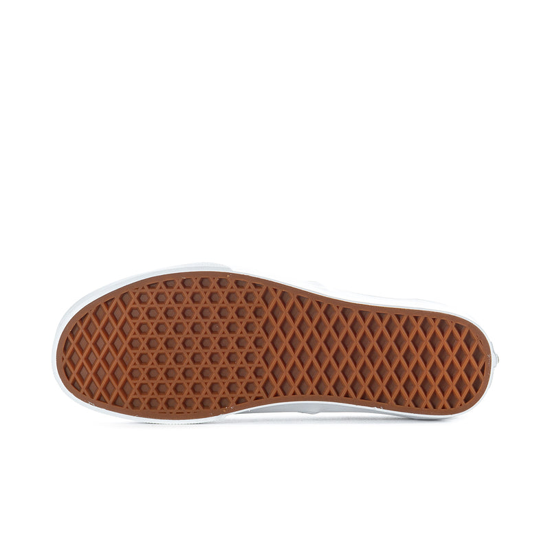 Vans sneaker outsole with brown waffle tread and white edge