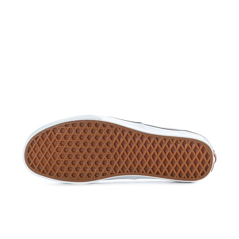 Outsole of men's dark gray canvas sneaker with textured gum rubber tread