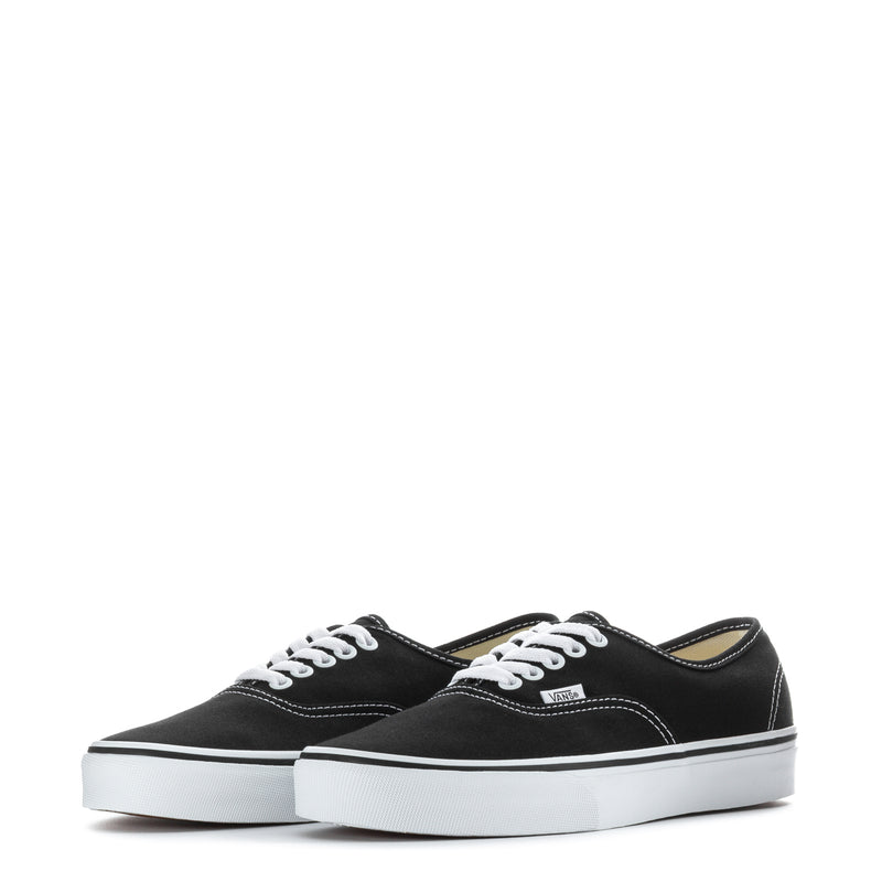 Pair of black Vans Authentic Wide sneakers with white laces and low rubber sole