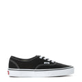 Youth black canvas low-top sneaker with white stitching and lace eyelets