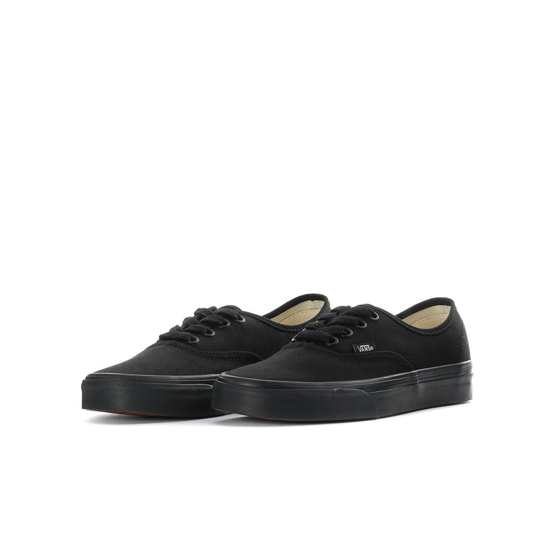 Black youth lace-up sneaker, low-profile canvas upper and sidewall stripe