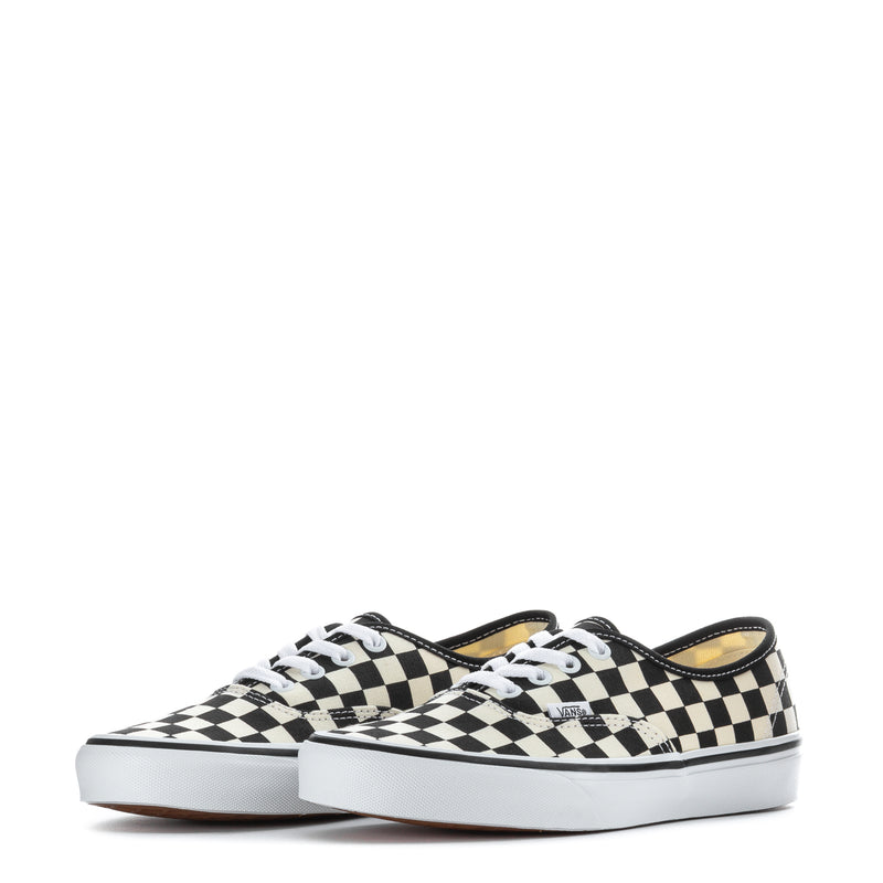 Pair of youth checkerboard canvas lace-up sneakers, black and white, front view