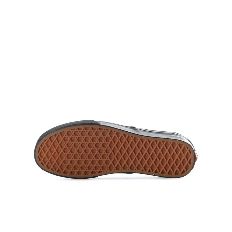 Black youth sneaker outsole with brown waffle traction pattern