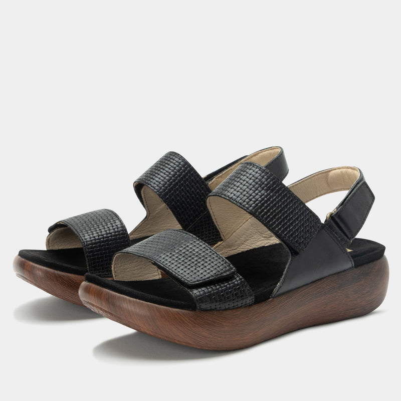 Bailee Woven Noir ankle strap adjustable sandal with non-flexing sleek rocker bottom with built in arch support.