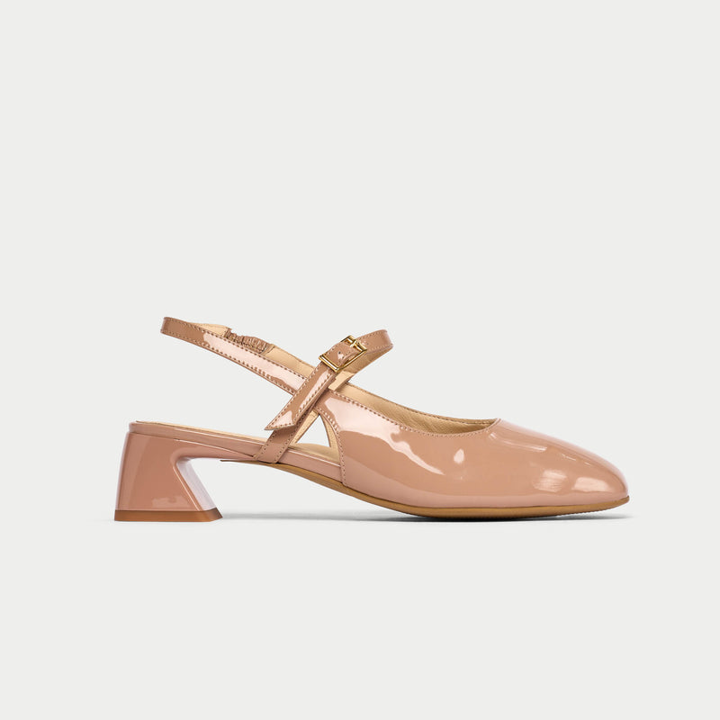 Beige-colored shoe with a low heel on a light gray background