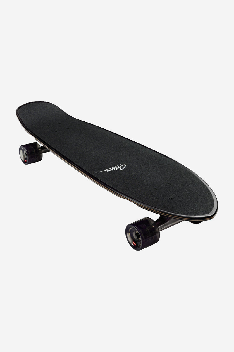 Diagonal view along Melt 32 inch cruiser deck highlighting the dark finish and exposed trucks and wheels