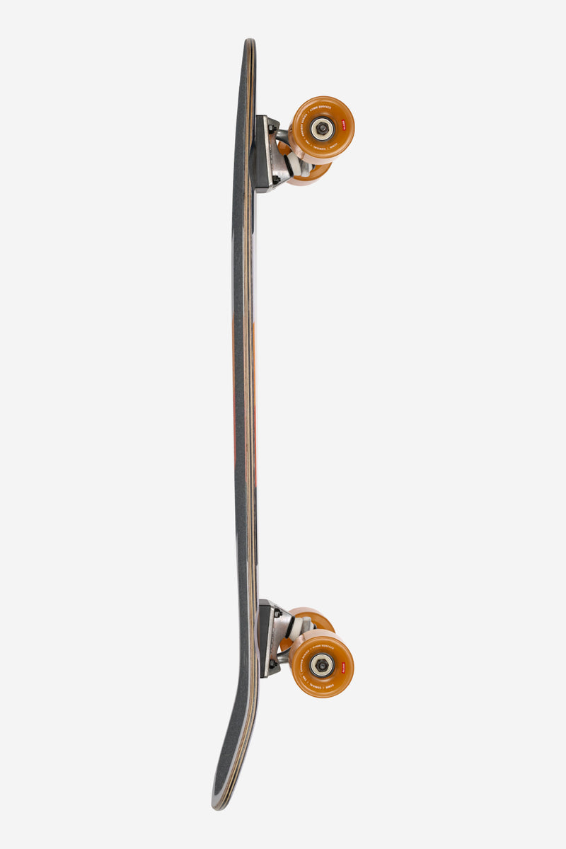 Side view of the Tune In cruiser revealing slim profile and orange wheels