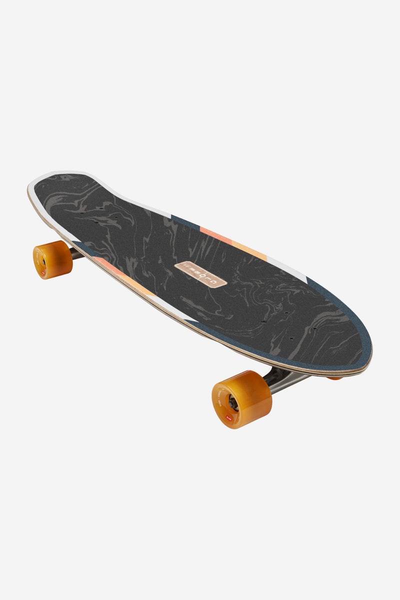 Angled perspective of the Tune In cruiser highlighting marble deck and orange wheels