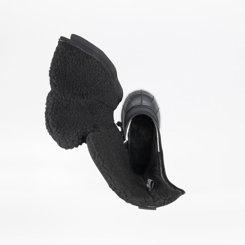 Top view of a single Black BILLY Ice Boot by BILLY Footwear, open to reveal the warm, fuzzy lining and insulated material for kids, shown against a white background.