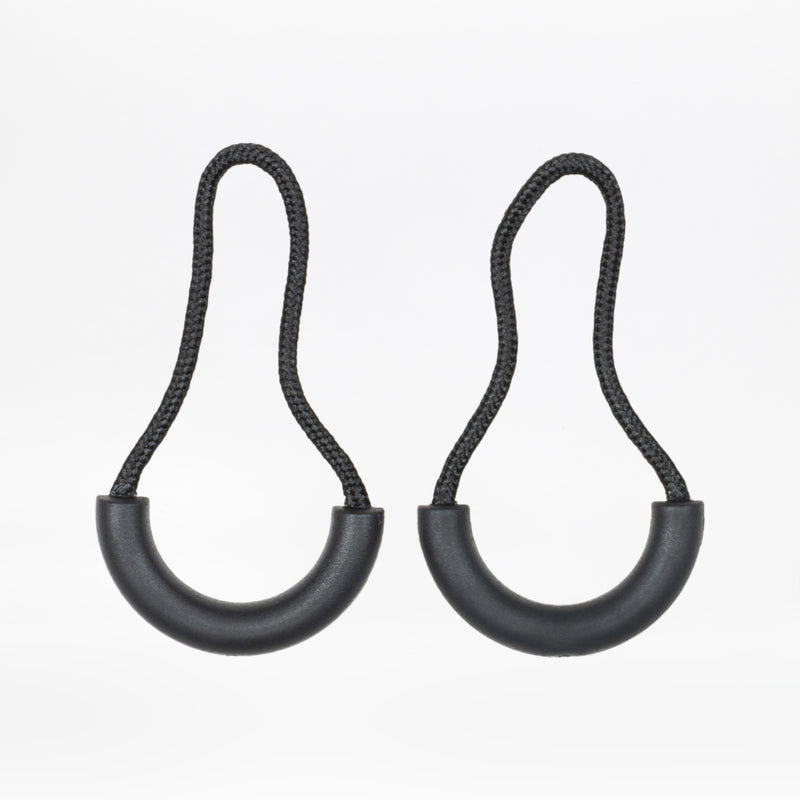 Two black zipper pulls with rubber half loops and black cord on a white background