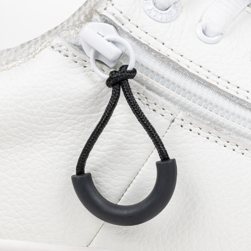 Black loop zipper pull attached to a white sneaker