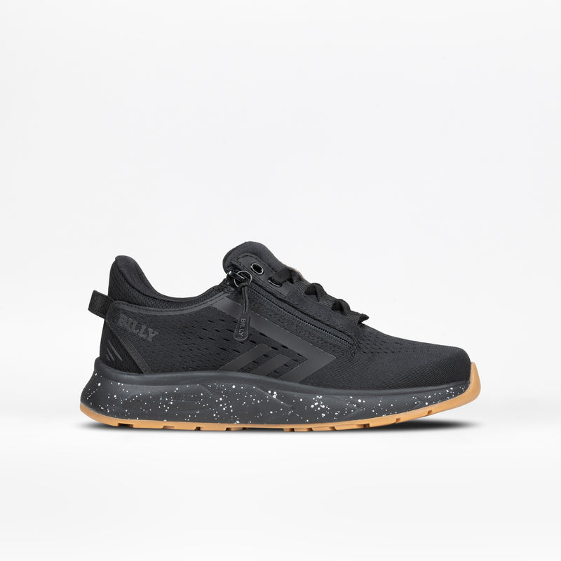 The BILLY Footwear Black/Black/Gum BILLY Sport Inclusion DZ1 sneaker features a gum sole, side zipper, mesh upper, and speckled midsole. Shown from the side against a plain white background.