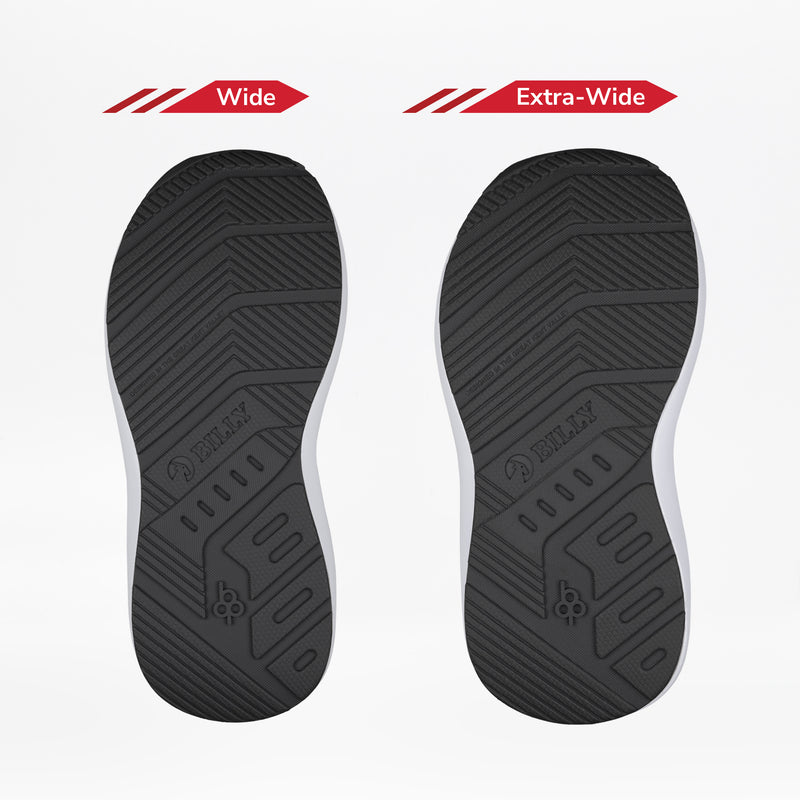 Two black shoe soles from the Black/Gold BILLY Goat Hoop by BILLY Footwear are displayed side by side. The left is marked Wide, and the right Extra-Wide, emphasizing width choices for orthotic or AFO-friendly shoes.