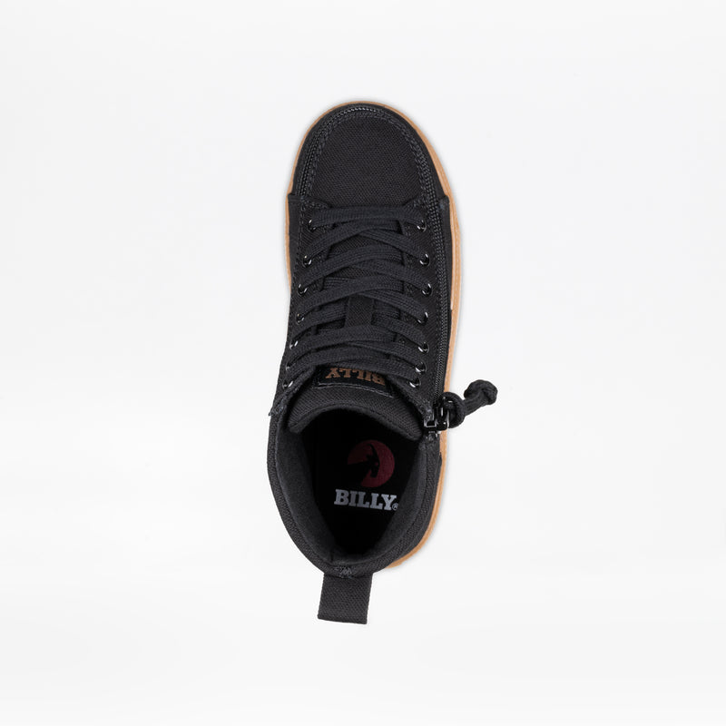 The Black/Gum BILLY CS High by BILLY Footwear is a kids’ high top sneaker with black laces, a side wrap zipper, and a brown sole. The insole features the BILLY logo in white and red on a white background.