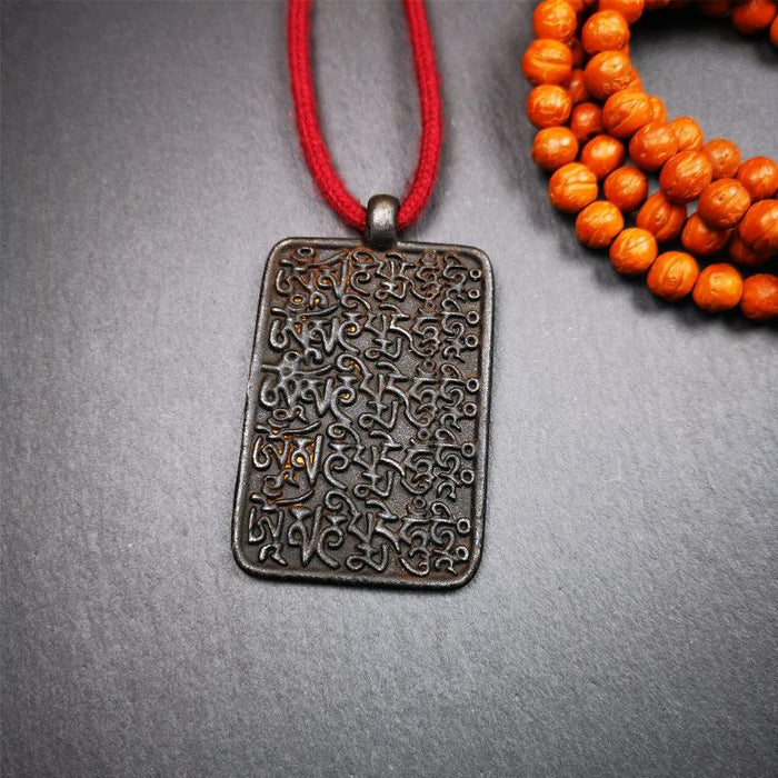 Black Om Melong 2.52" - Tibetan Buddhist art, detailed view