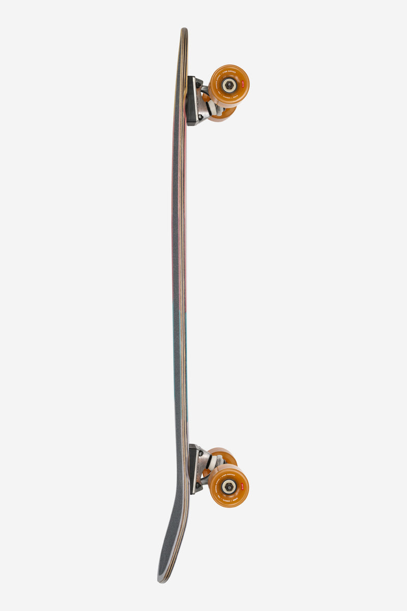 Side profile of Blazer XL Dig It longboard highlighting its slim shape colorful edges and orange wheels.