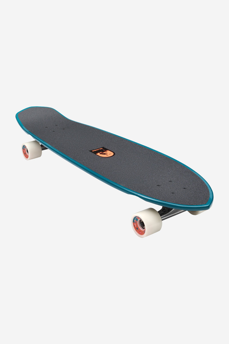 Three-quarter perspective of Twilight Expedition longboard deck showing teal edge and orange logo centered on the grip tape