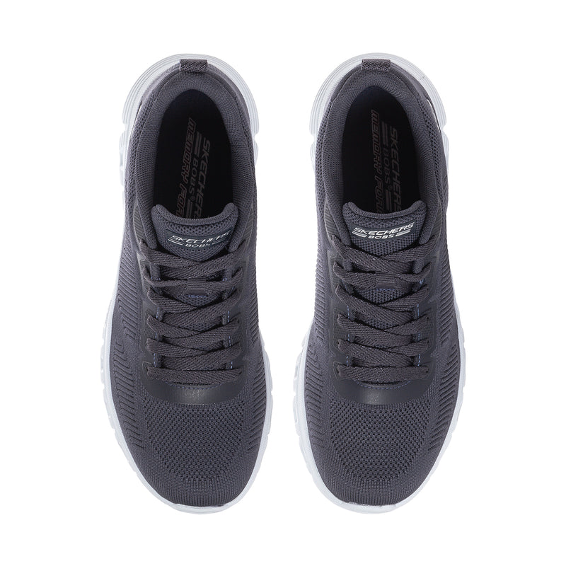 Dark navy knit shoes with lace-up front and cushioned interior opening