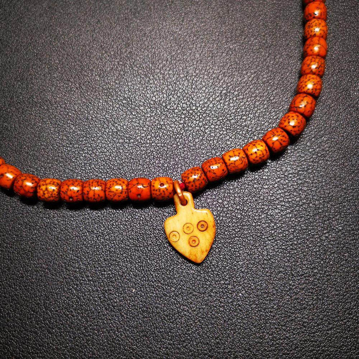 Bone Carved Nubro Pendant - Tibetan Buddhist art, detailed view