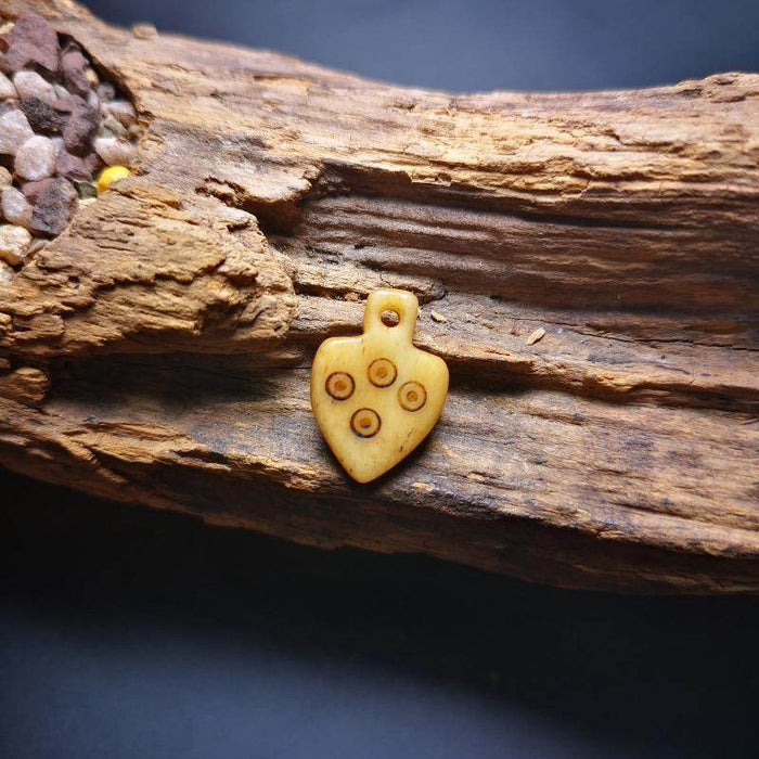 Bone Carved Nubro Pendant - Tibetan Buddhist art, size reference