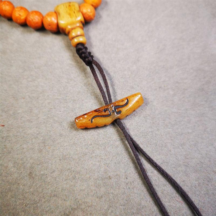 Bone Ruyi Amulet Pendant 1.1" - Tibetan Buddhist amulet, detailed view