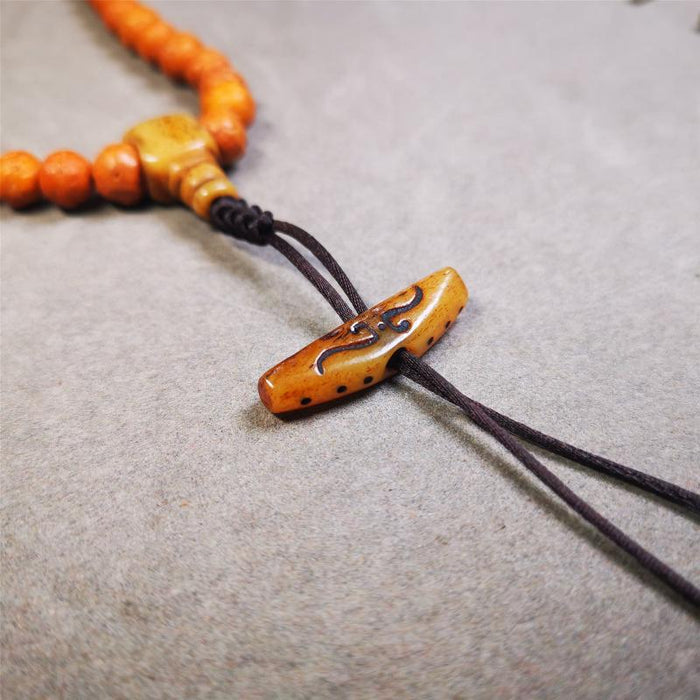 Bone Ruyi Amulet Pendant 1.1" - Tibetan Buddhist amulet, close-up detail