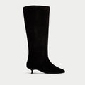 Black knee-high boot on a light gray background