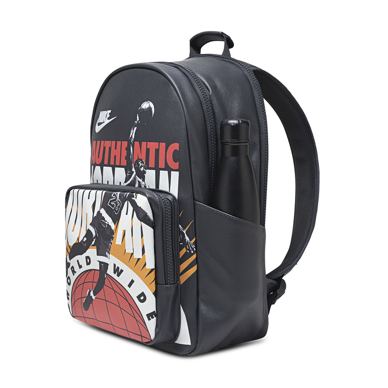 Black backpack with side zip pocket and front graphic pouch, curved shoulder strap.
