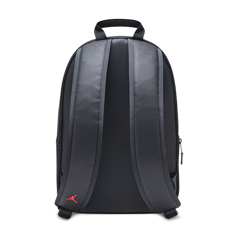 Black backpack back view with adjustable shoulder straps and small logo at bottom.