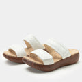 Brayah White adjustable sandal with non-flexing sleek rocker bottom with built in arch support
