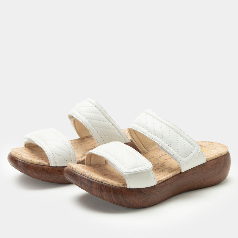 Brayah White adjustable sandal with non-flexing sleek rocker bottom with built in arch support