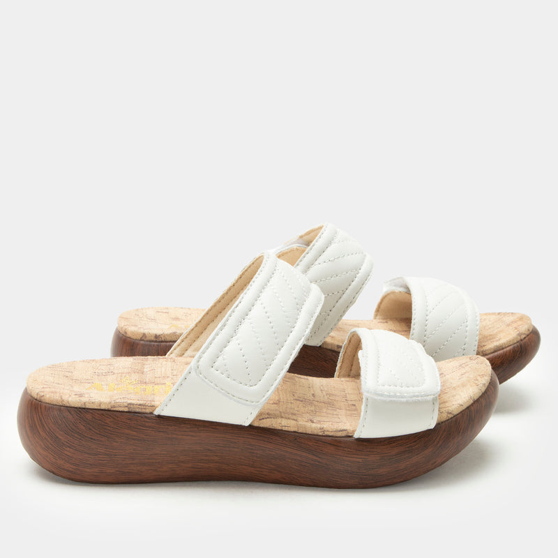 Brayah White adjustable sandal with non-flexing sleek rocker bottom with built in arch support