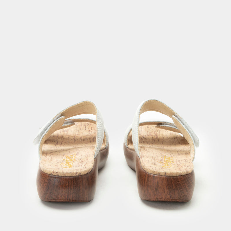Brayah White adjustable sandal with non-flexing sleek rocker bottom with built in arch support