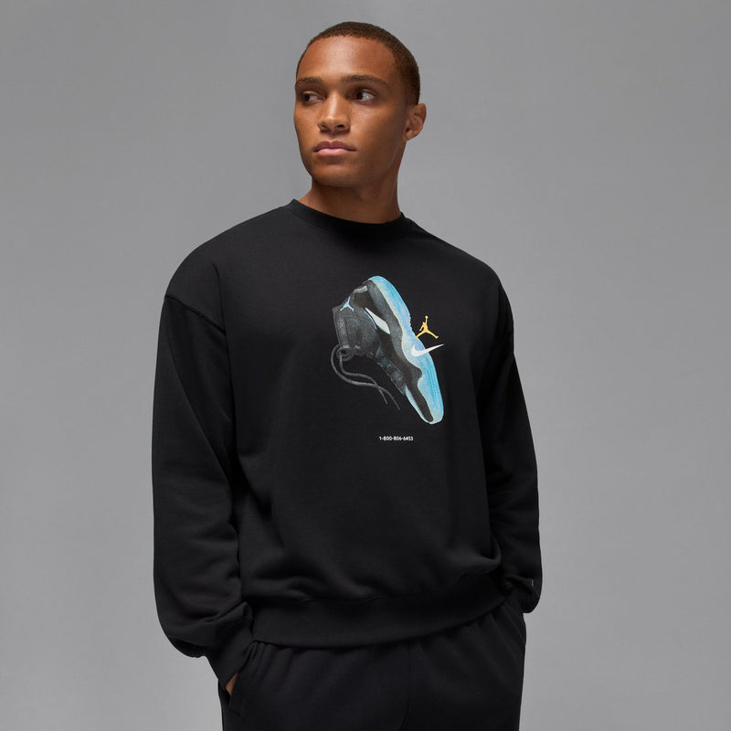 Black crewneck sweatshirt with blue sneaker artwork and yellow Jumpman logo on chest