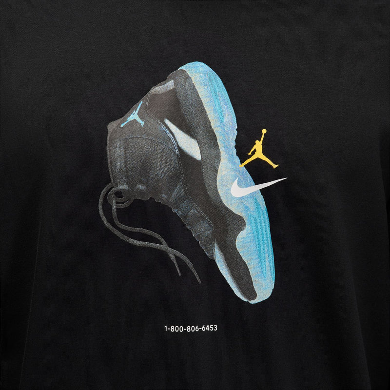 Black sweatshirt chest graphic showing blue sneaker, Nike swoosh, and yellow Jumpman