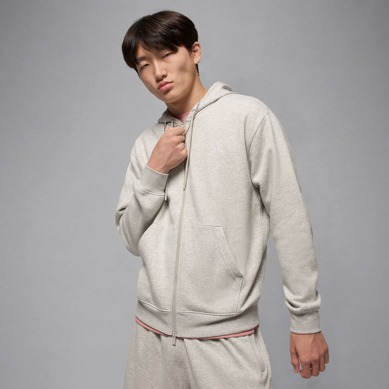 Men's heather grey full-zip fleece hoodie worn with front zip and kangaroo pocket