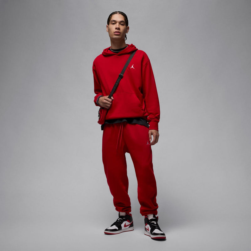 Men’s red fleece jogger pants with drawstring waist and side logo, full view