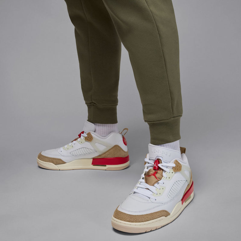 Men's olive fleece jogger pants showing tapered hem with ribbed ankle cuff