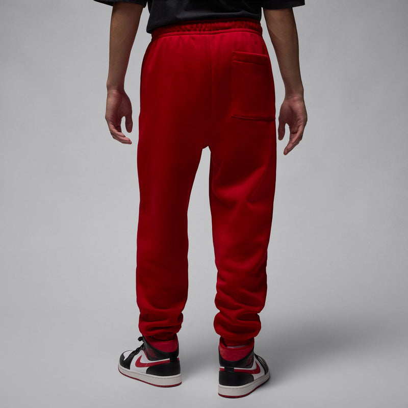 Men’s red fleece jogger pants, back view with elastic waistband