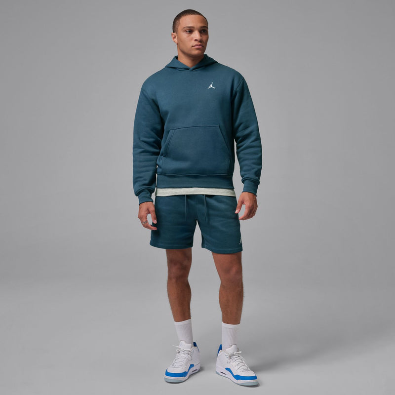 Men's squadron blue fleece pullover hoodie worn with matching shorts; Jumpman logo on chest.