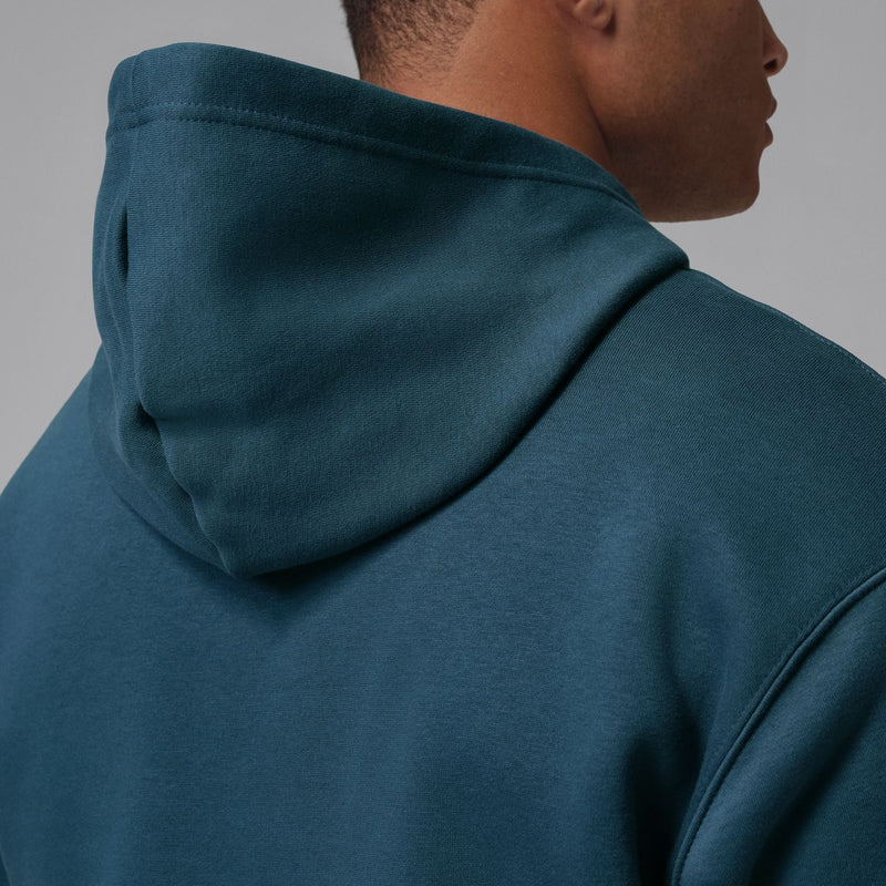 Men's squadron blue fleece hoodie side close-up showing hood seam and shoulder panel.