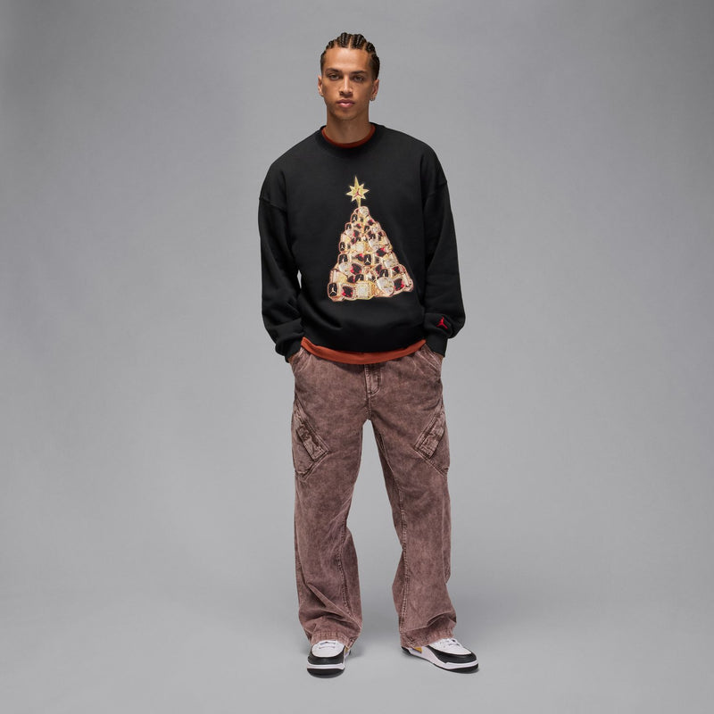 Black men’s fleece crewneck sweatshirt featuring a holiday tree graphic on front