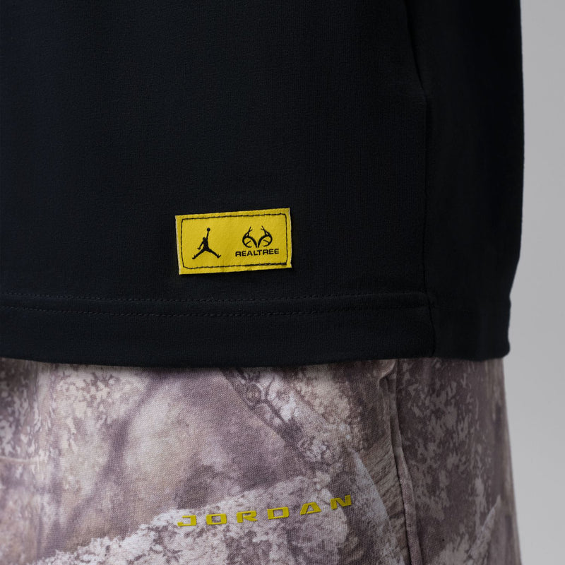 Black tee hem with yellow RealTree Air label patch