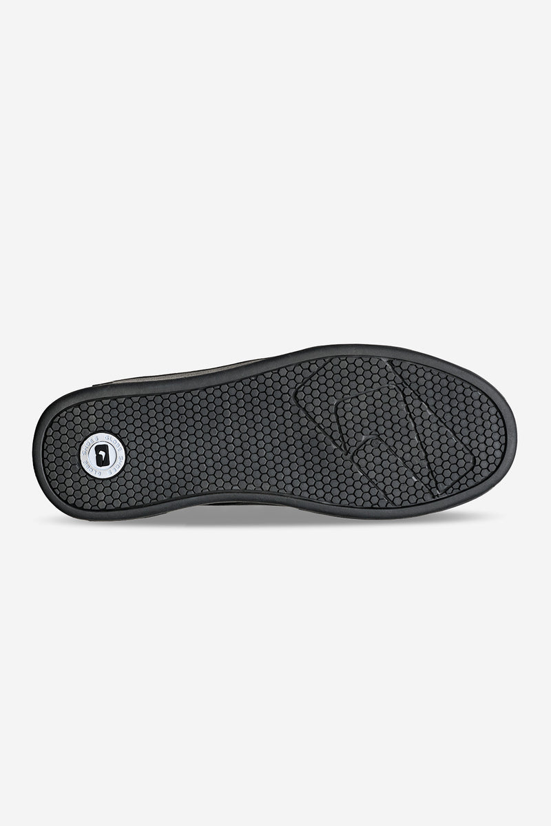 Outsole view of Castro black suede moccasin loafer with hexagonal tread pattern and logo emblem
