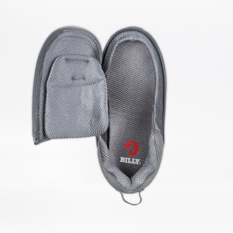 The Charcoal BILLY Limitless by BILLY Footwear is a gray, sensory-friendly shoe with a fully opening zipper for easy access and comfort, featuring the BILLY logo in white and red on the insole.