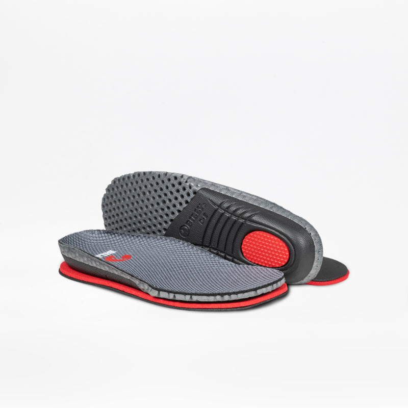 A pair of Charcoal BILLY Limitless insoles by BILLY Footwear—one flat, one propped to show the textured sole and cushioned heel—are displayed against a white background.