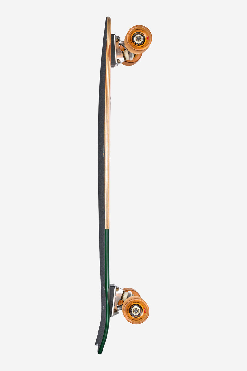 Side view of Chromantic Beach Bum cruiser longboard with orange wheels and natural maple deck.
