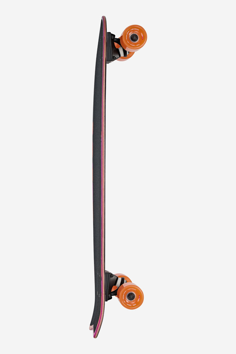 Rear side view of Chromantic Cruiserboard 33 Sea Devil with orange wheels and tapered swallow tail.