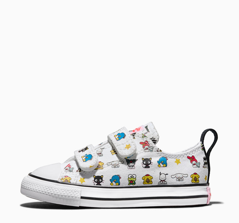 Toddler low-top sneakers side view, white canvas with character graphics and hook strap